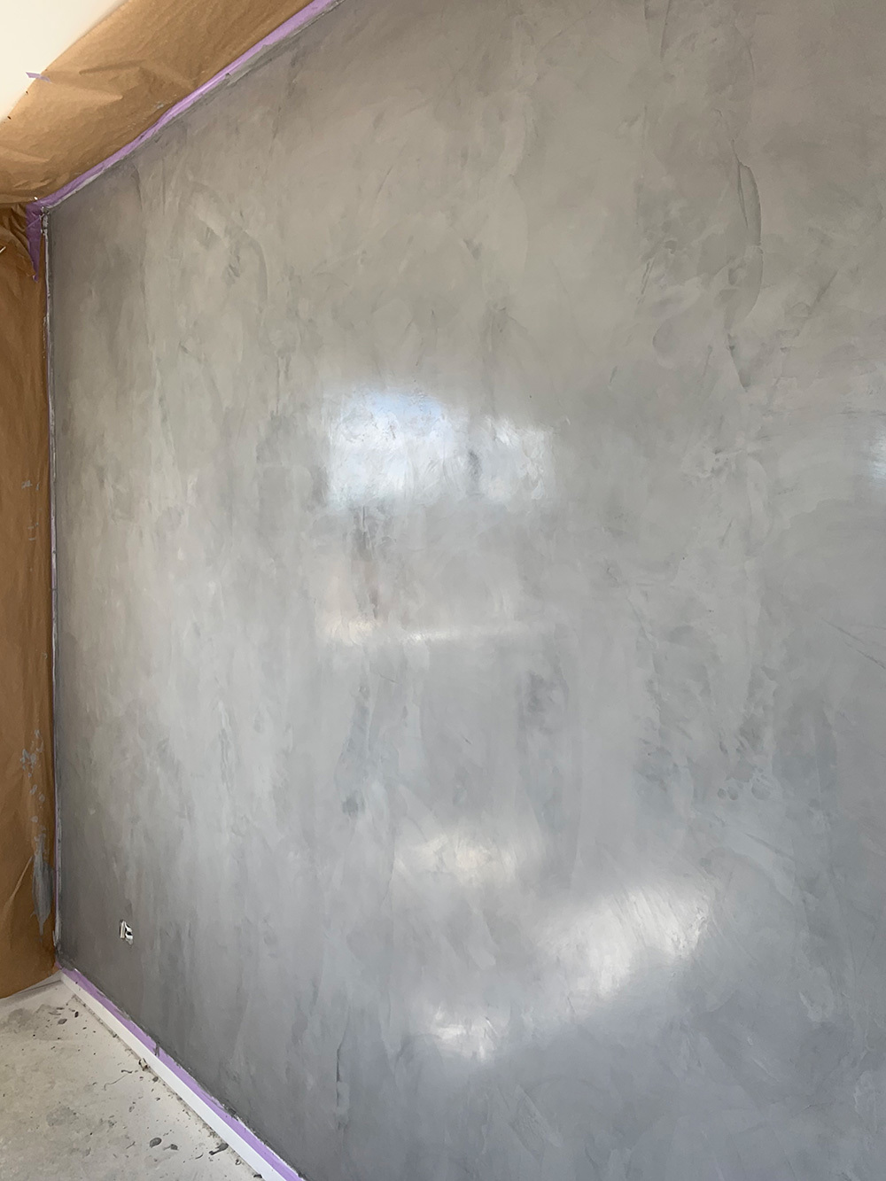 Polished plaster decorative coating on an interior wall by MIM Limited